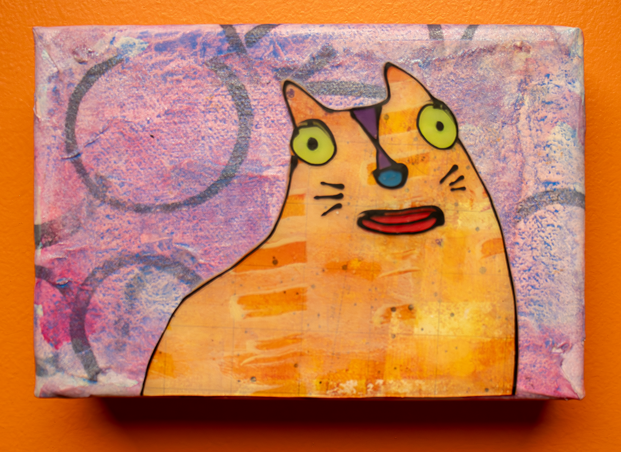 O-Kitty painting depicting yellow cat with green eyes