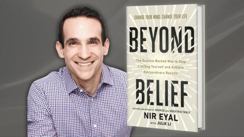 Author Nir Eyal sits next to a cover of his book, "Beyond Belief" in front of a gray background.